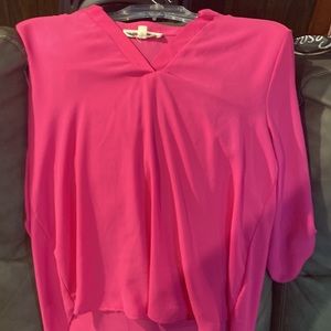 This beautiful woman’s blouse size Large